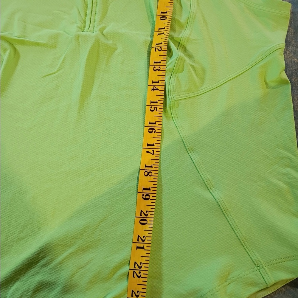 Bright neon green Lululemon sleeveless athletic top with half zip front. - Picture 4 of 7